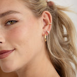 model weaing hoops, small diamond hoops and a dainty ear cuff