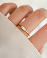 Gold Opal Baguette Ring by Samijewels-527 featuring a central opal gemstone and baguette-cut accents in a sleek ring design.