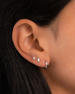 Sami Jewels opal baguette stud earrings featuring rectangular white opal gemstones set in silver or gold metal.