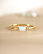 Gold Opal Baguette Ring by Samijewels-527 featuring a rectangular opal gemstone set in a sleek gold band.
