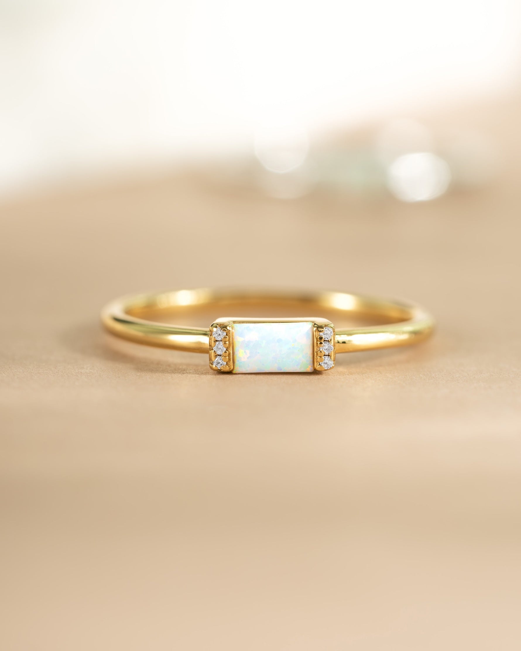 Gold Opal Baguette Ring by Samijewels-527 featuring a rectangular opal gemstone set in a sleek gold band.