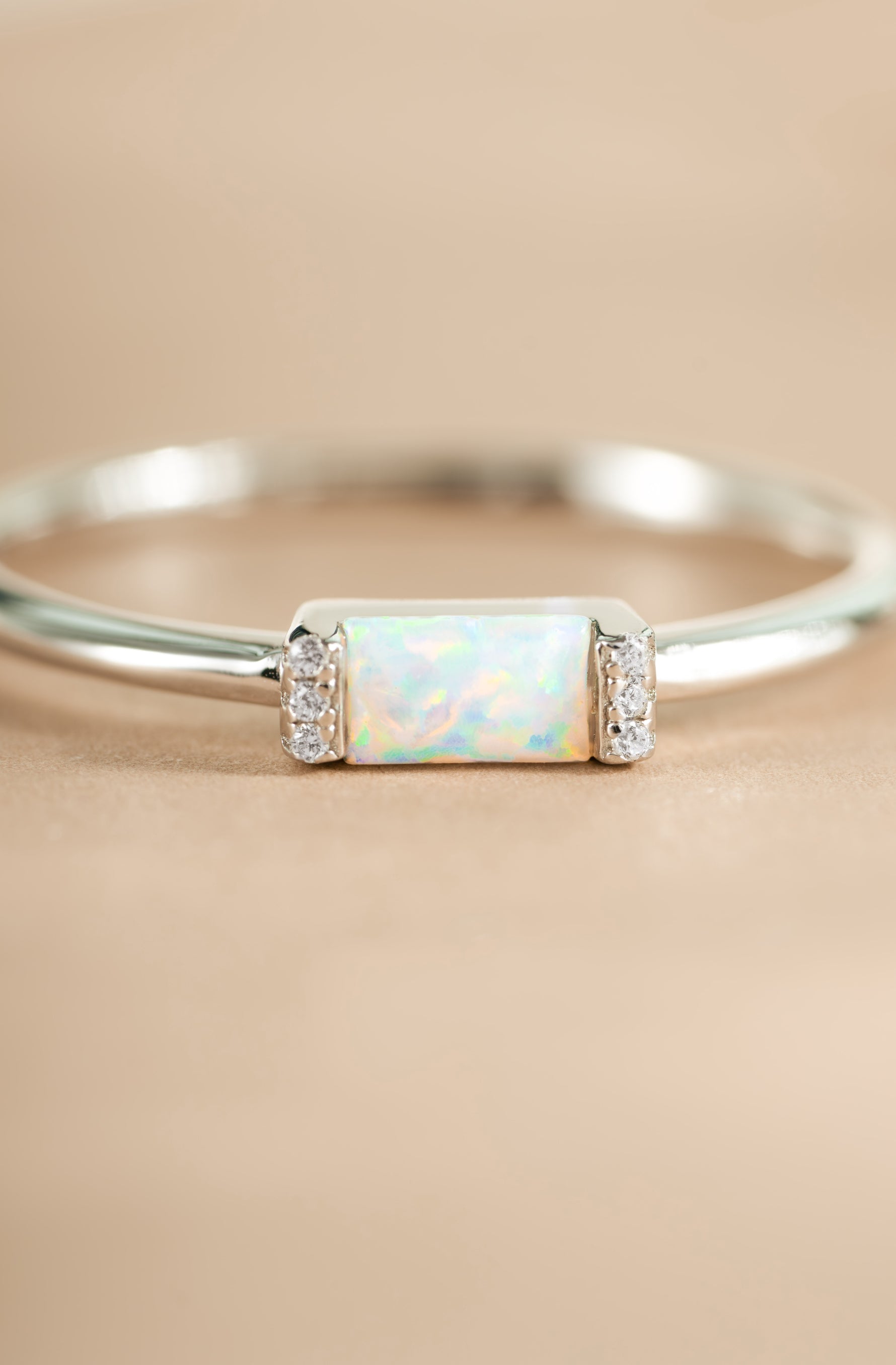 Close-up of Samijewels-527 Opal Baguette Ring in sterling silver showing the detailed opal gemstone and sleek band design.