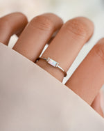 Sterling silver Opal Baguette Ring by Samijewels-527 displayed on a model with the ring on finger.