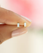 Close-up of gold Opal Baguette Stud Earrings by Sami Jewels showing the elegant opal gemstones on small gold posts.