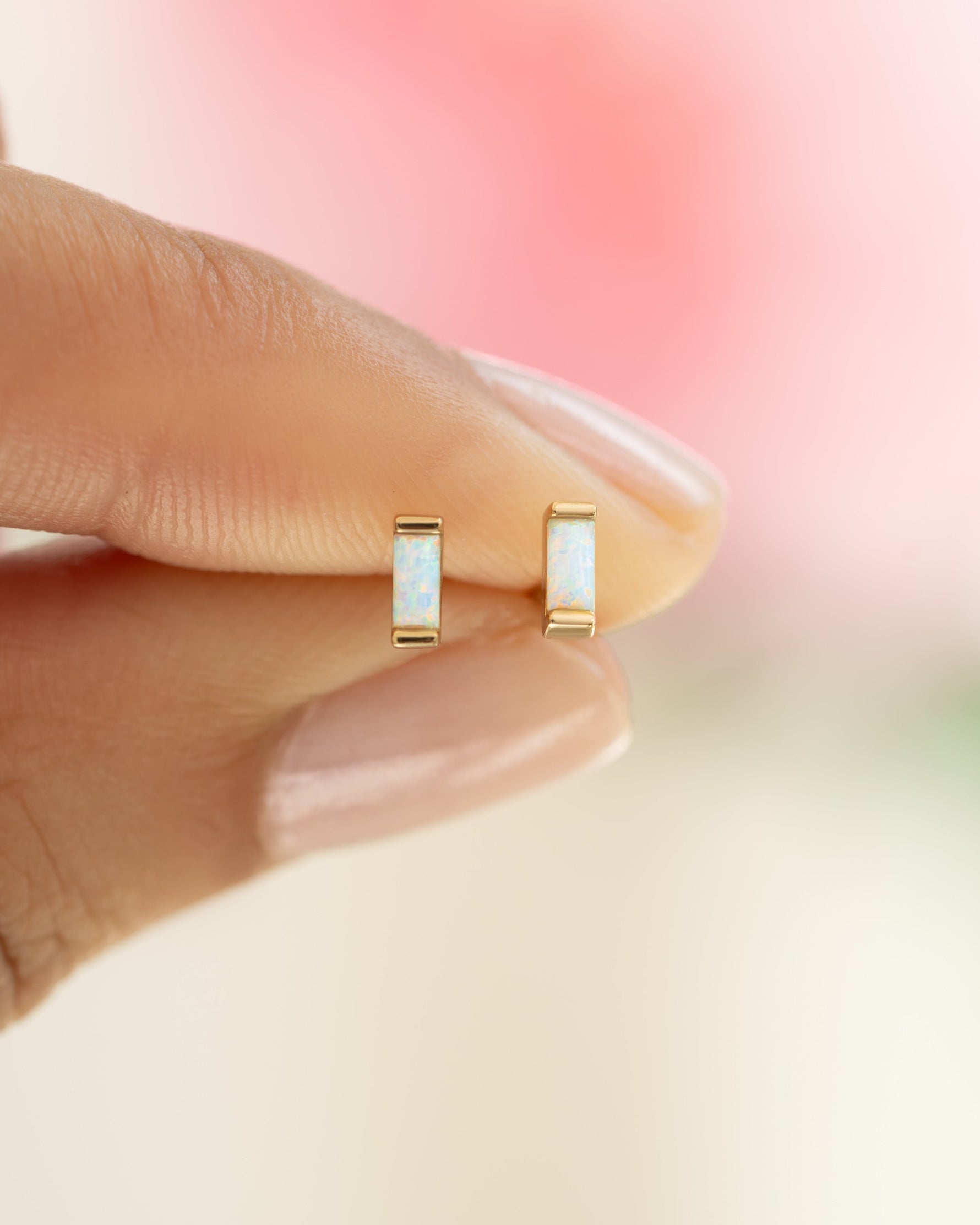 Close-up of gold Opal Baguette Stud Earrings by Sami Jewels showing the elegant opal gemstones on small gold posts.