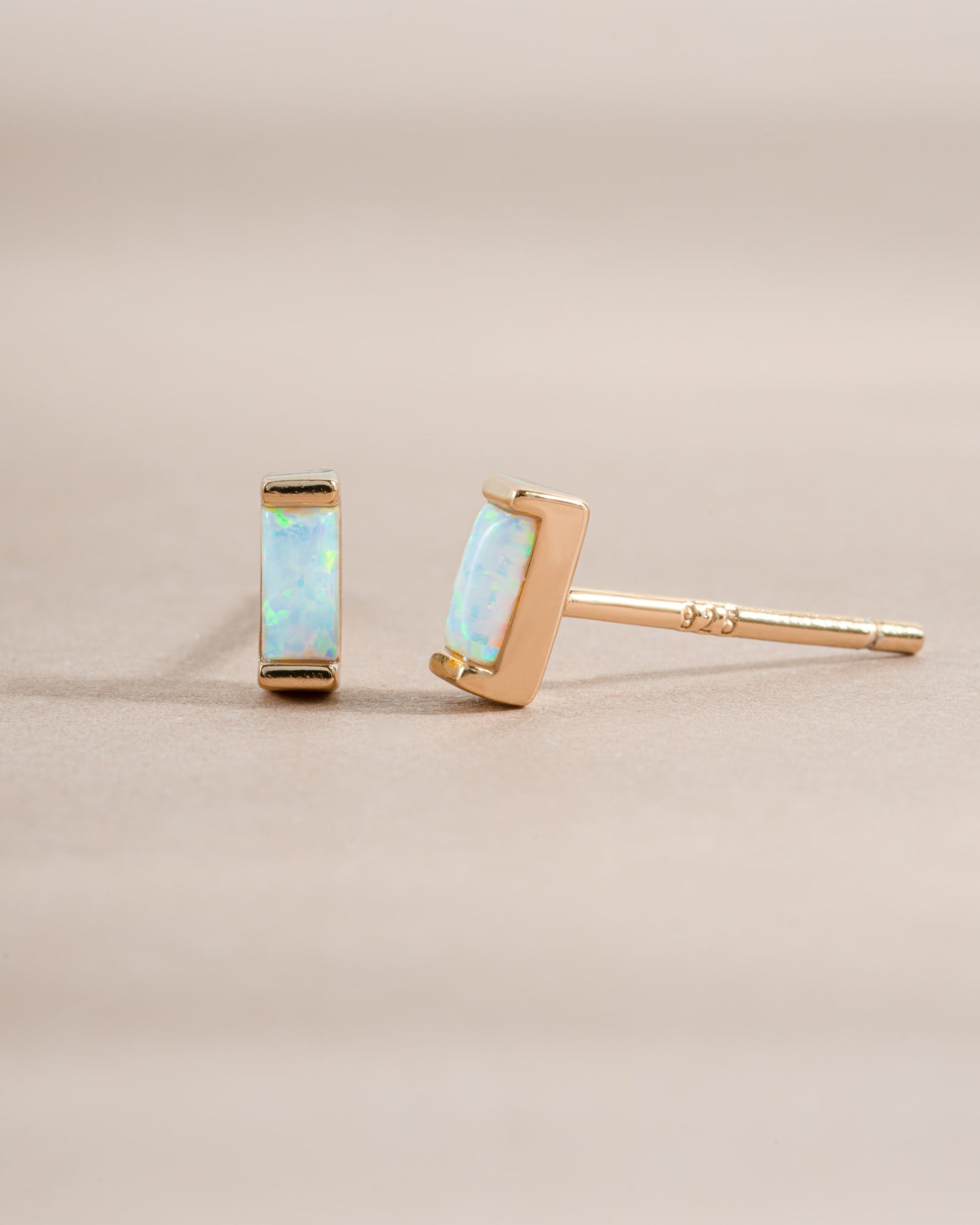 Gold Sami Jewels Opal Baguette Stud Earrings featuring rectangular opal gemstones set in a sleek gold setting.