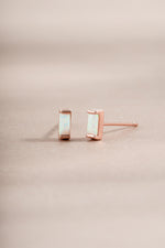 opal baguette stud earrings in role gold on neutral background