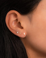 Gold Opal Baguette Stud Earrings by Sami Jewels, featuring rectangular opal gemstones set in gold earring studs.