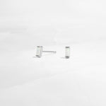 closeup of silver opal earrings 