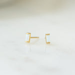closeup image of opal stud earrings