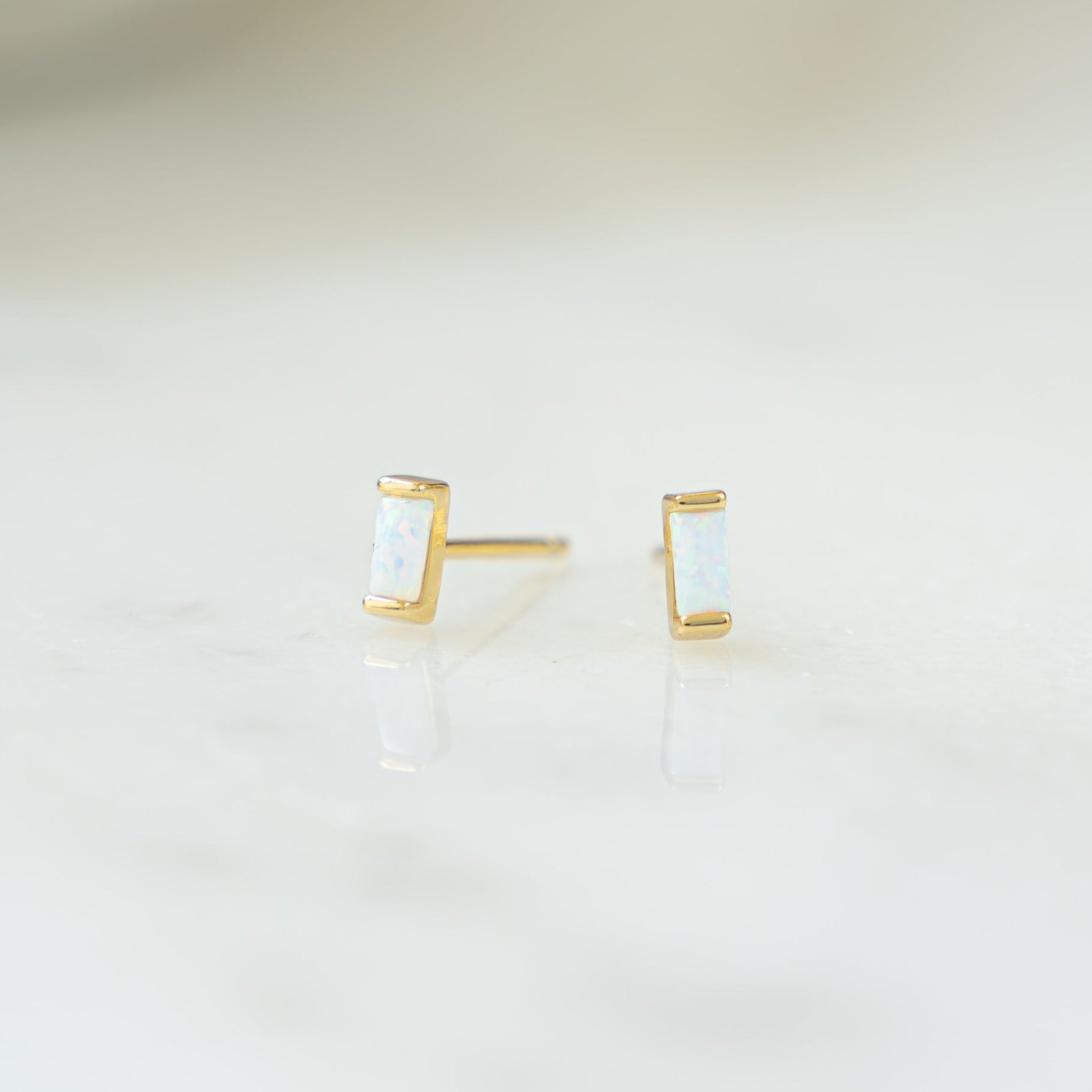 closeup image of opal stud earrings
