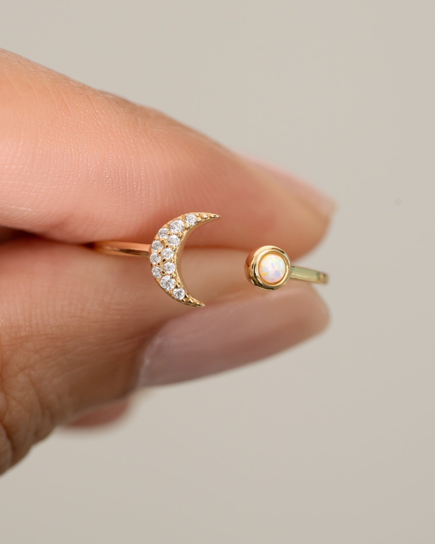 Close-up of Samijewels-527 Opal and CZ Moon Ring in gold, showcasing the detailed moon design and sparkling stones.