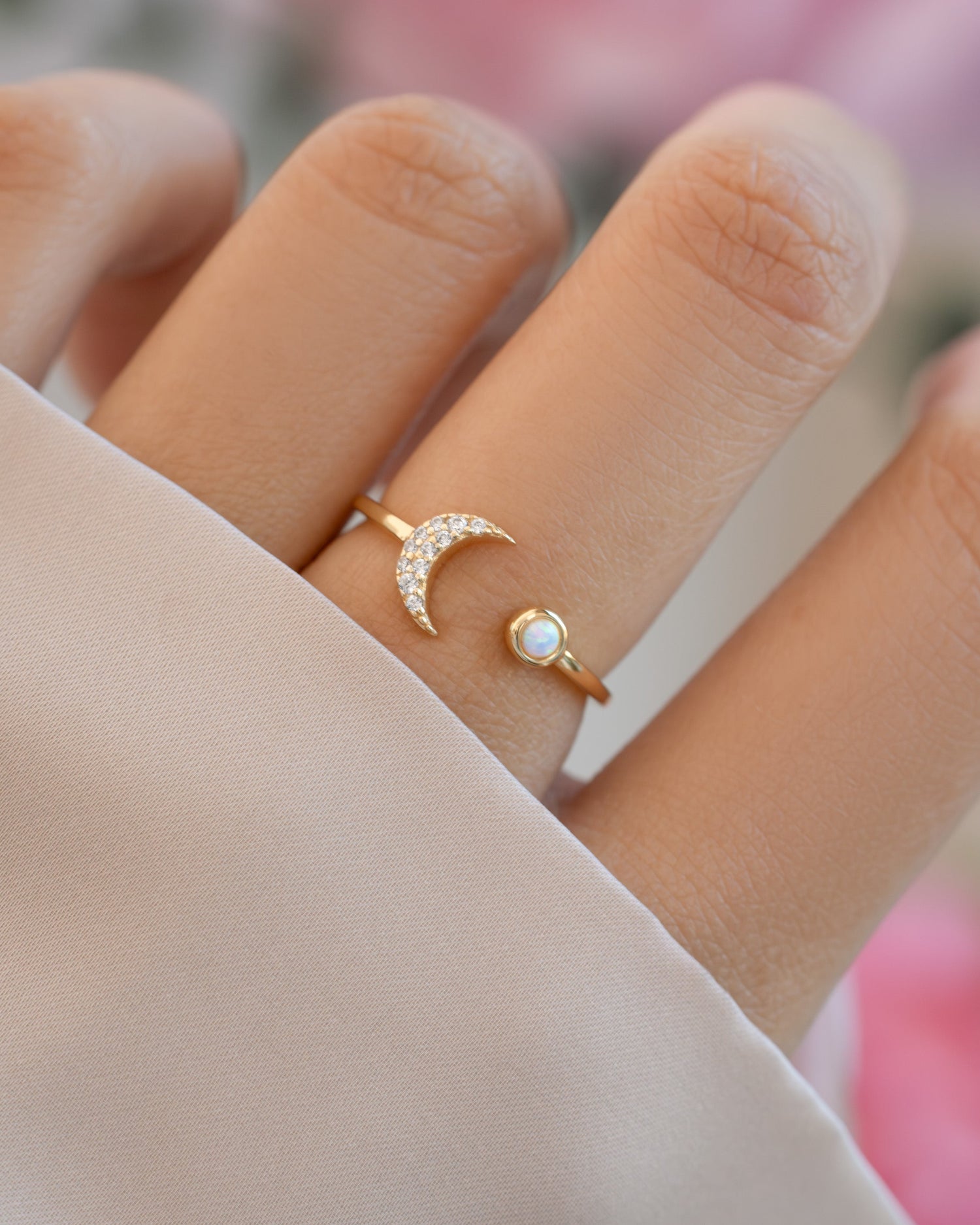 Gold Opal and CZ Moon Ring by Samijewels-527, featuring a moon-shaped design on a model's hand.