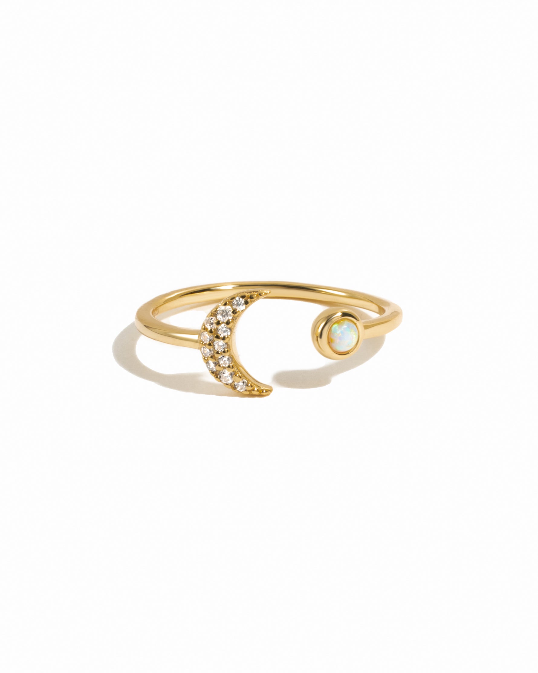 Gold Opal and CZ moon ring by Samijewels-527 featuring a luminous opal centerpiece and sparkling cubic zirconia accents.