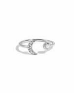 Sterling silver Opal & CZ Moon ring with a detailed moon design and sparkling stones, displayed on a white background.