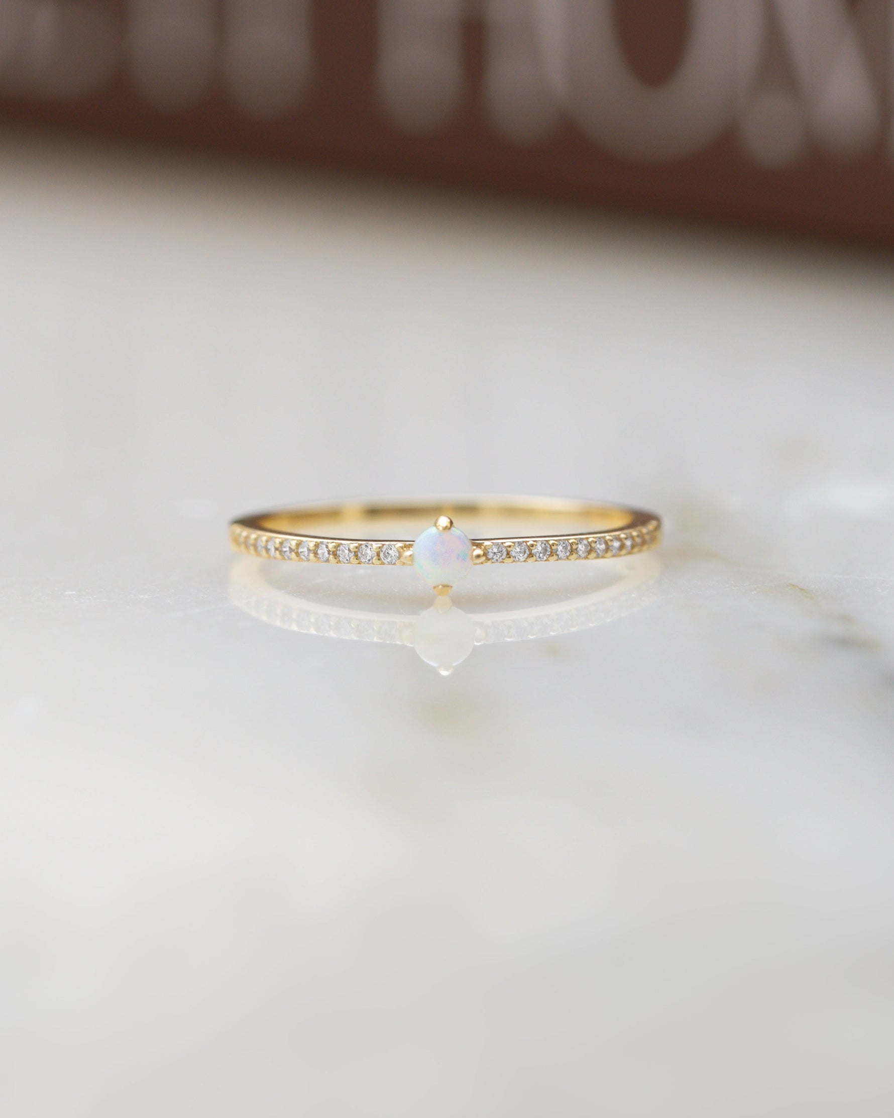 opal diamond ring in gold with pavé cubic zirconia diamond detailing