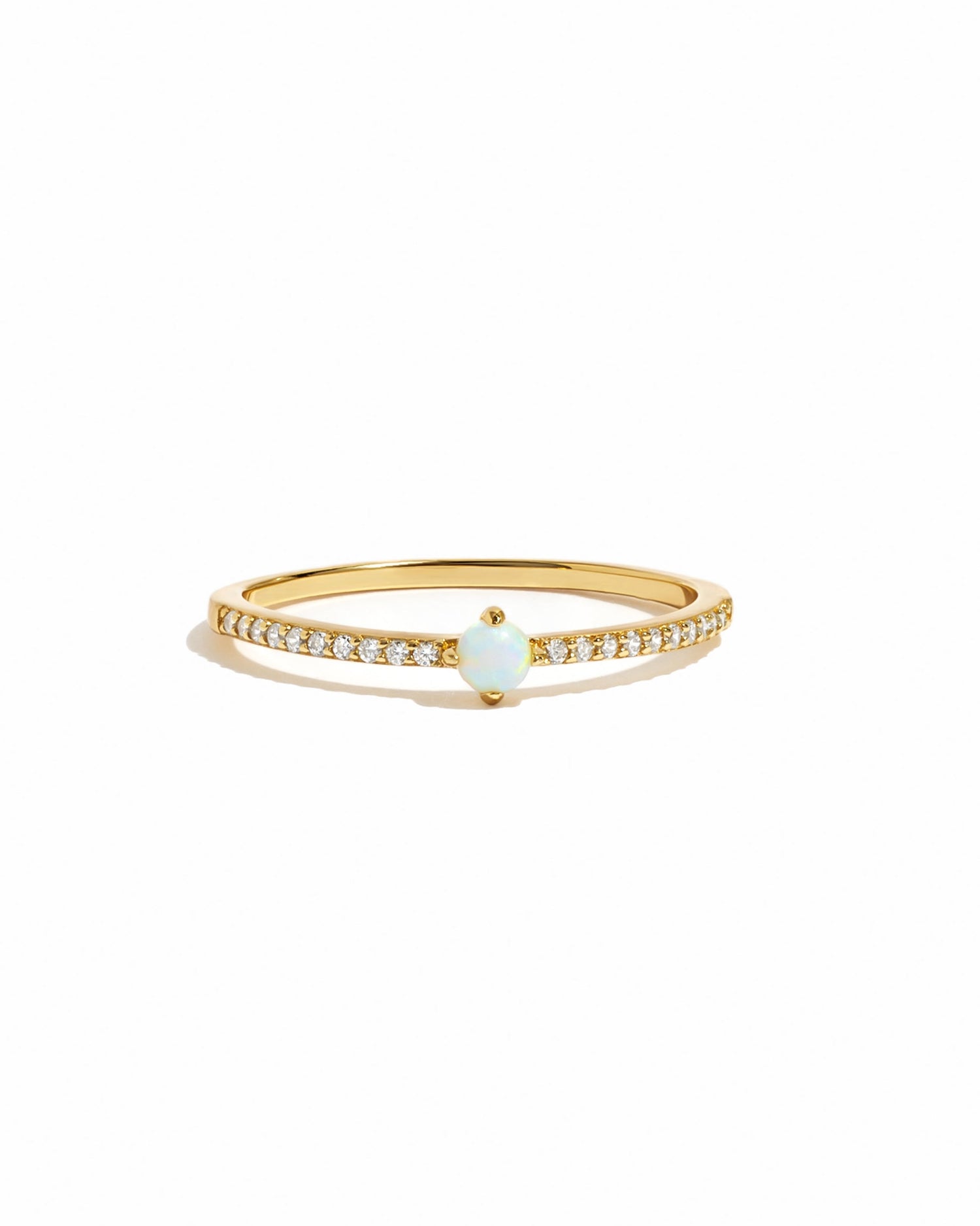 opal diamond ring in gold on a white background