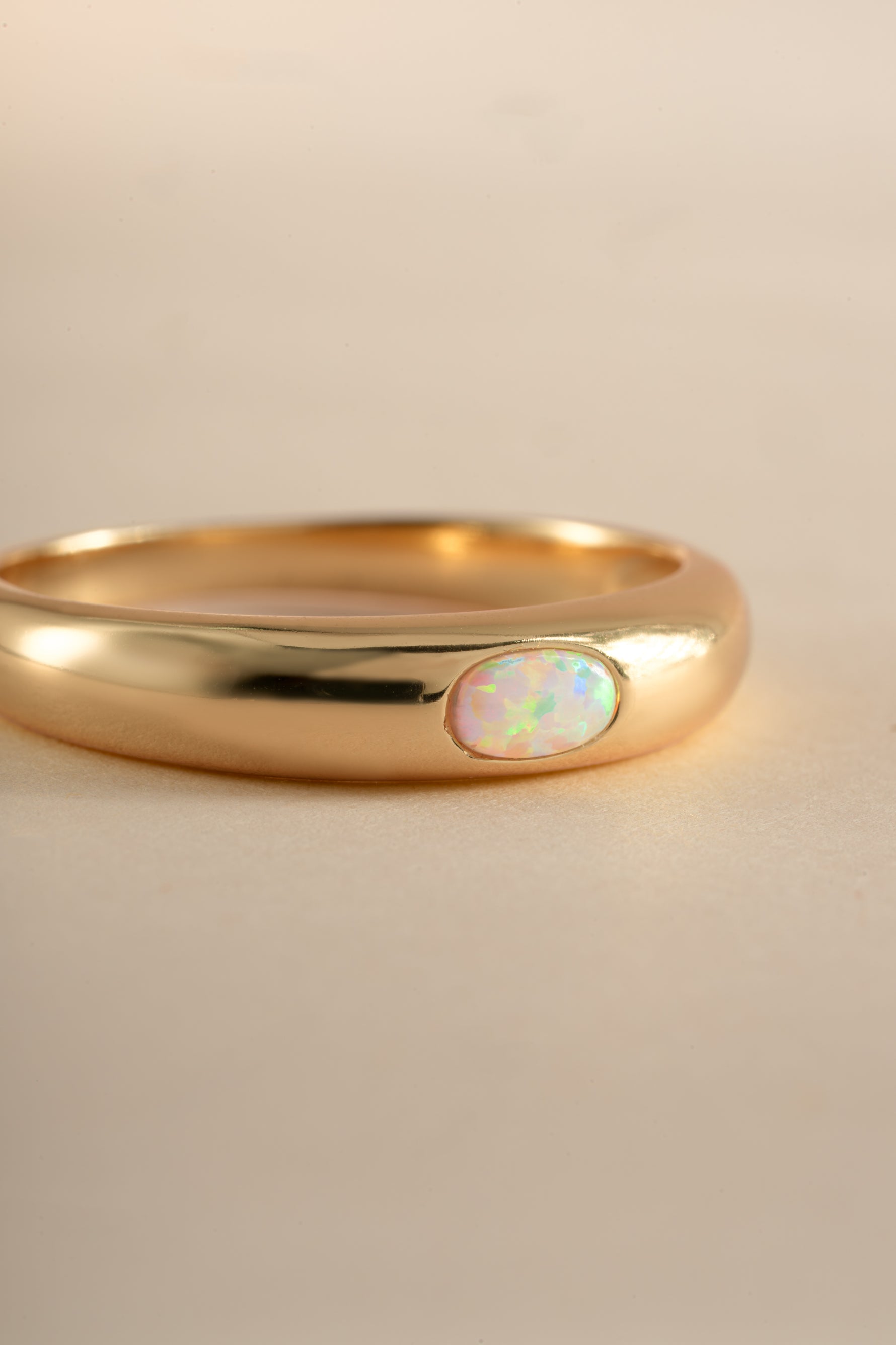 Close-up of Sami Jewels gold Opal Dome Ring showcasing the smooth, rounded opal gemstone on a sleek gold band.