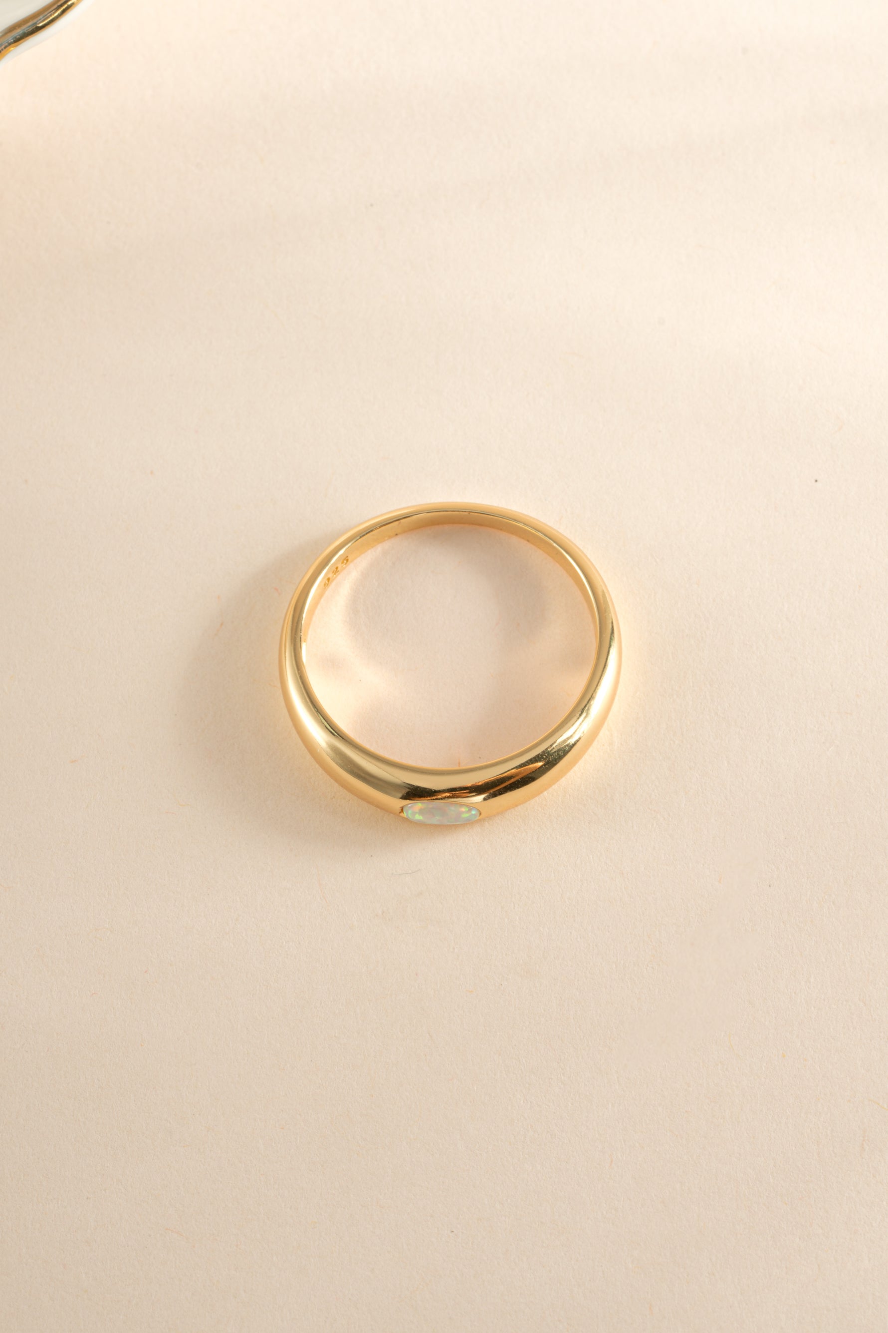 Gold Opal Dome Ring by Sami Jewels, top view showcasing the smooth, rounded opal gemstone set in a sleek gold band.