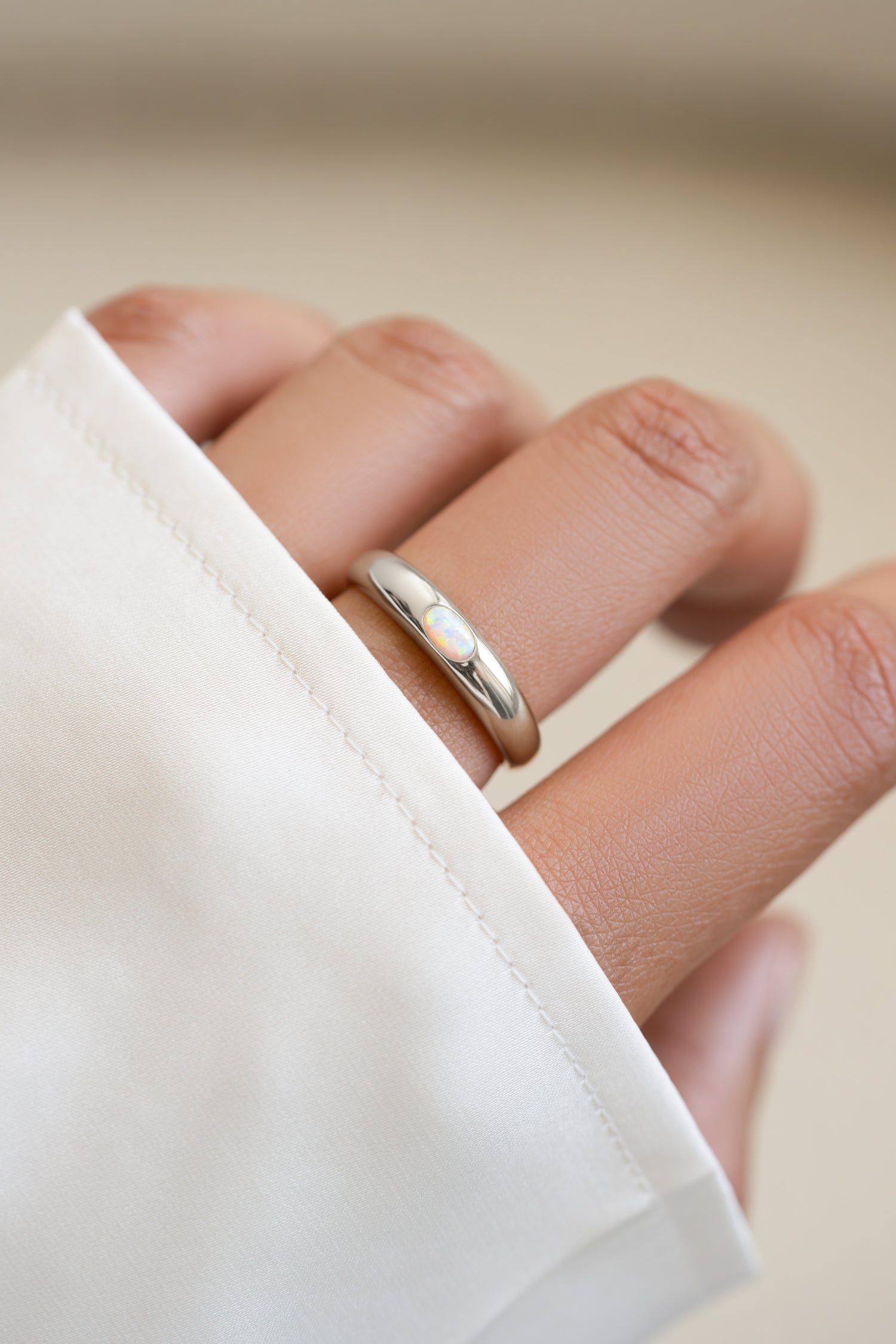 Sterling silver Opal Dome Ring by Sami Jewels with a smooth, rounded opal gemstone set in a sleek silver band.