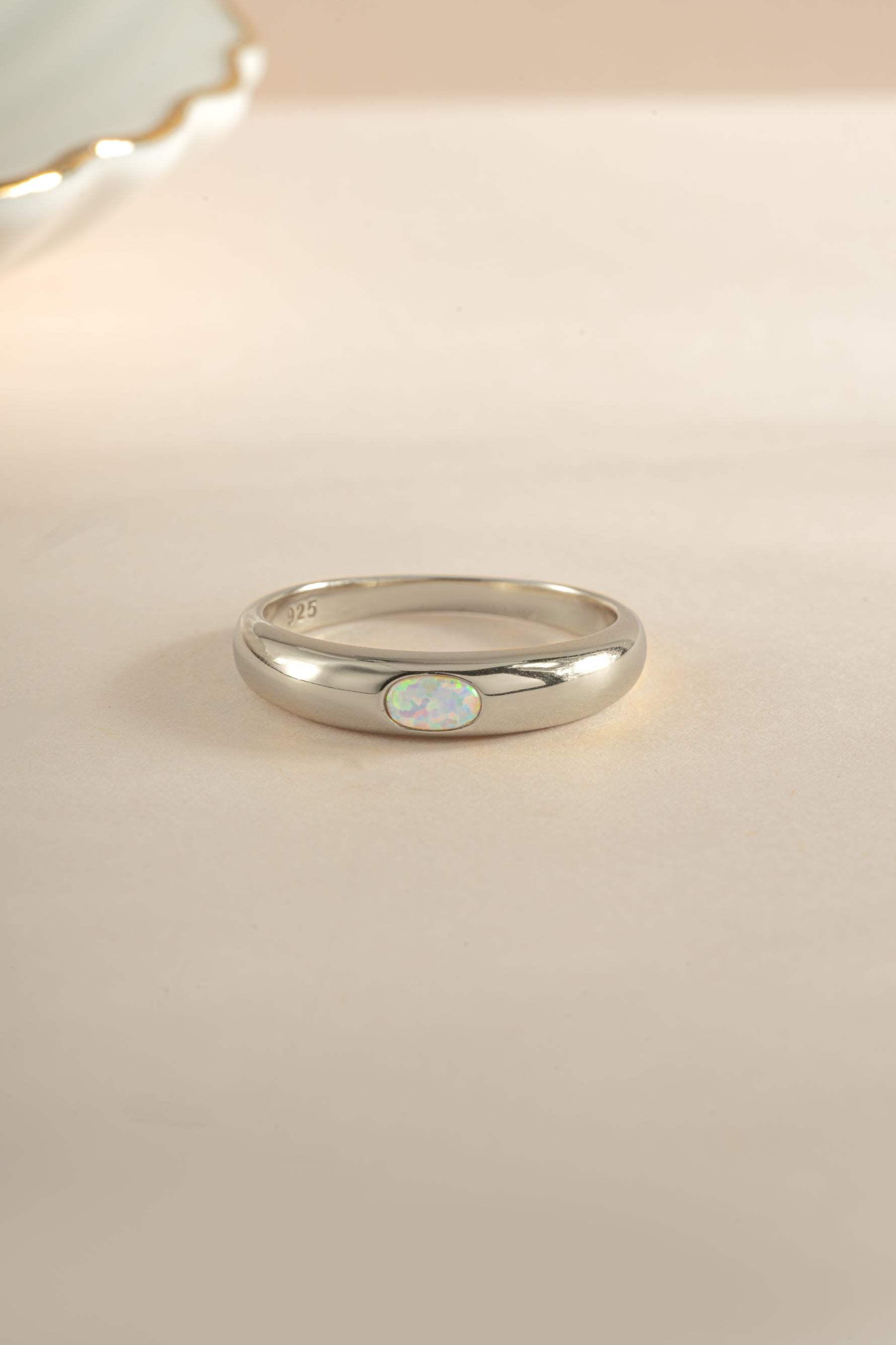 Sterling silver Opal Dome Ring by Sami Jewels featuring a smooth, rounded opal gemstone setting.