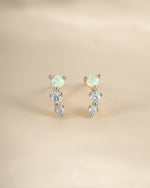 Sterling silver opal ear climber earrings by Sami Jewels featuring vibrant opal stones and sleek modern design