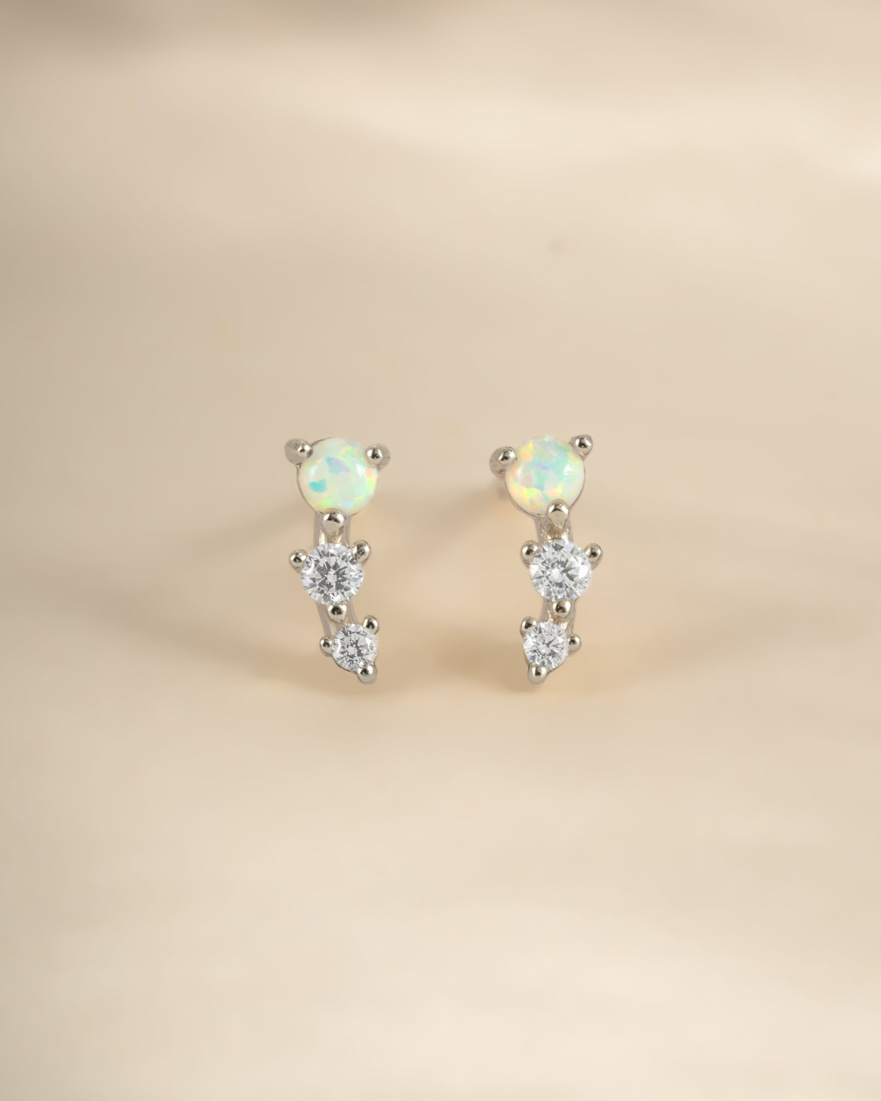 Sterling silver opal ear climber earrings by Sami Jewels featuring vibrant opal stones and sleek modern design