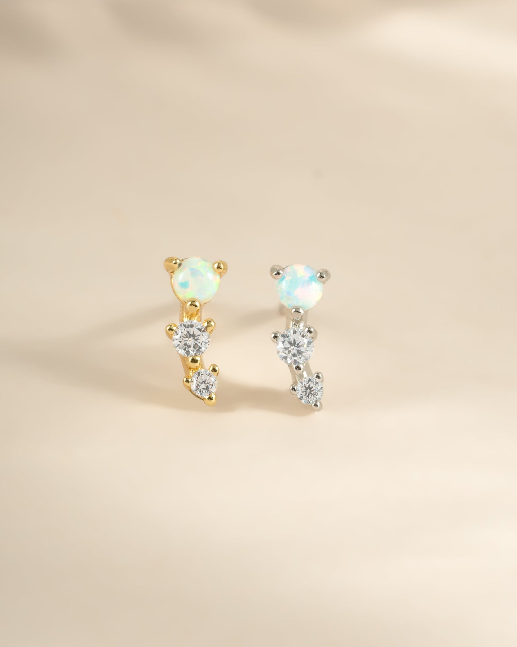 Gold and sterling silver opal ear climber earrings by Sami Jewels, featuring sparkling opal stones and elegant design.