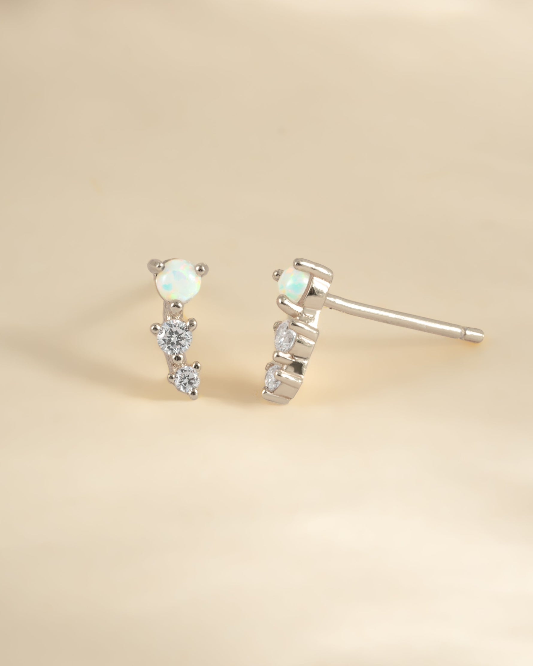 Sterling silver opal ear climber earrings with vibrant, iridescent opal stones designed for elegant ear adornment by Sami Jewels