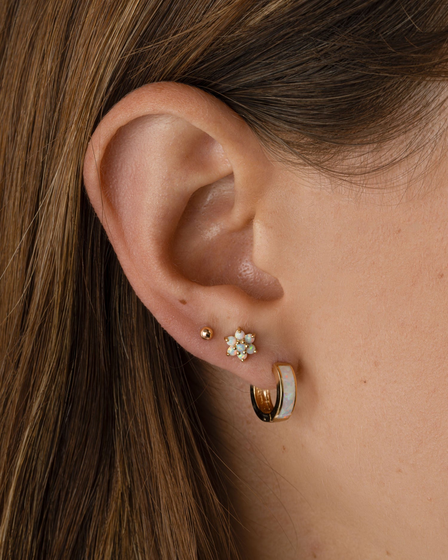 Gold Opal Enamel Huggie Earrings from Sami Jewels, showcasing smooth, rounded earrings with vibrant enamel and subtle opal accents.