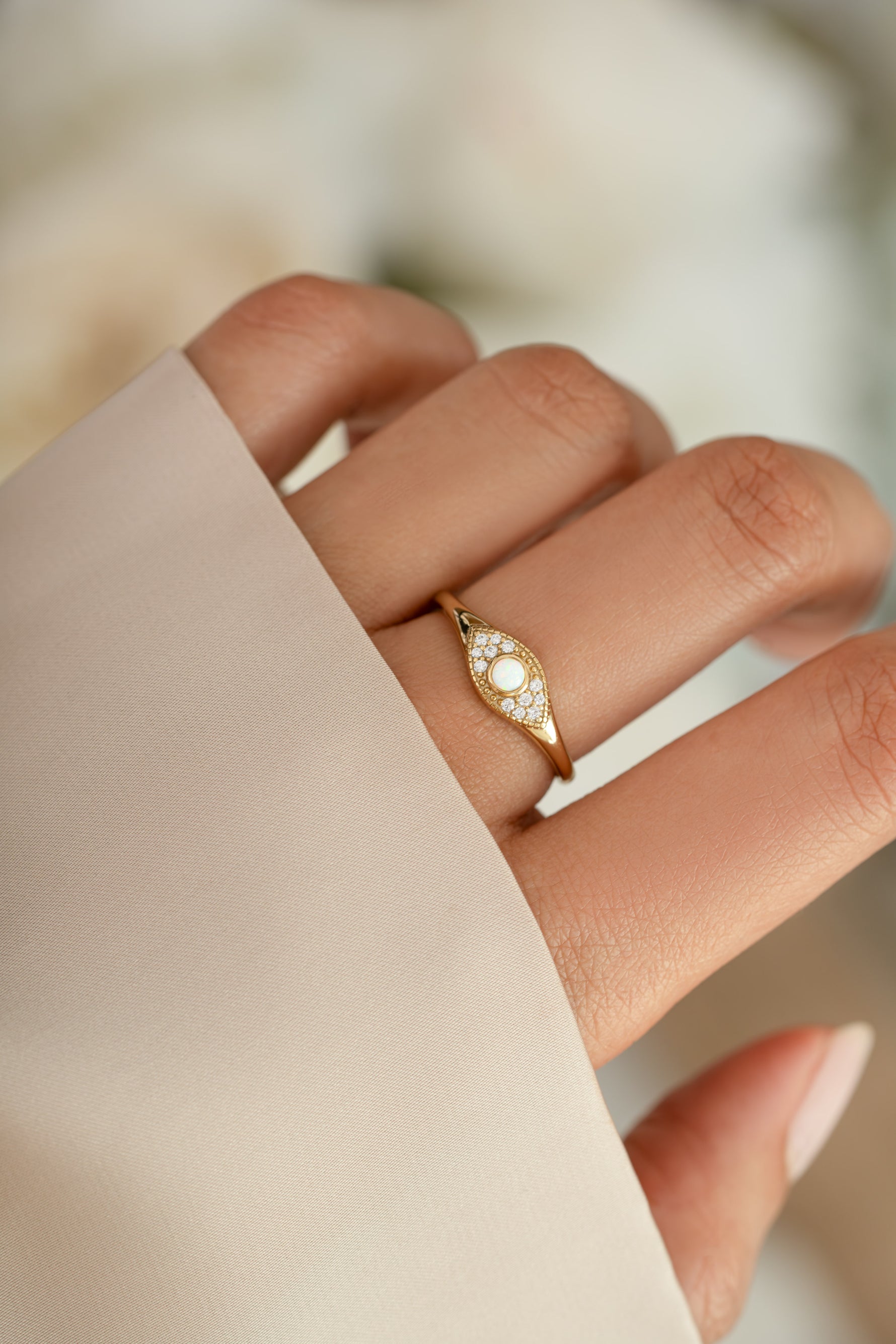 Gold Opal Evil Eye Ring by Sami Jewels featuring a vibrant opal gemstone and intricate evil eye design on a sleek ring band.