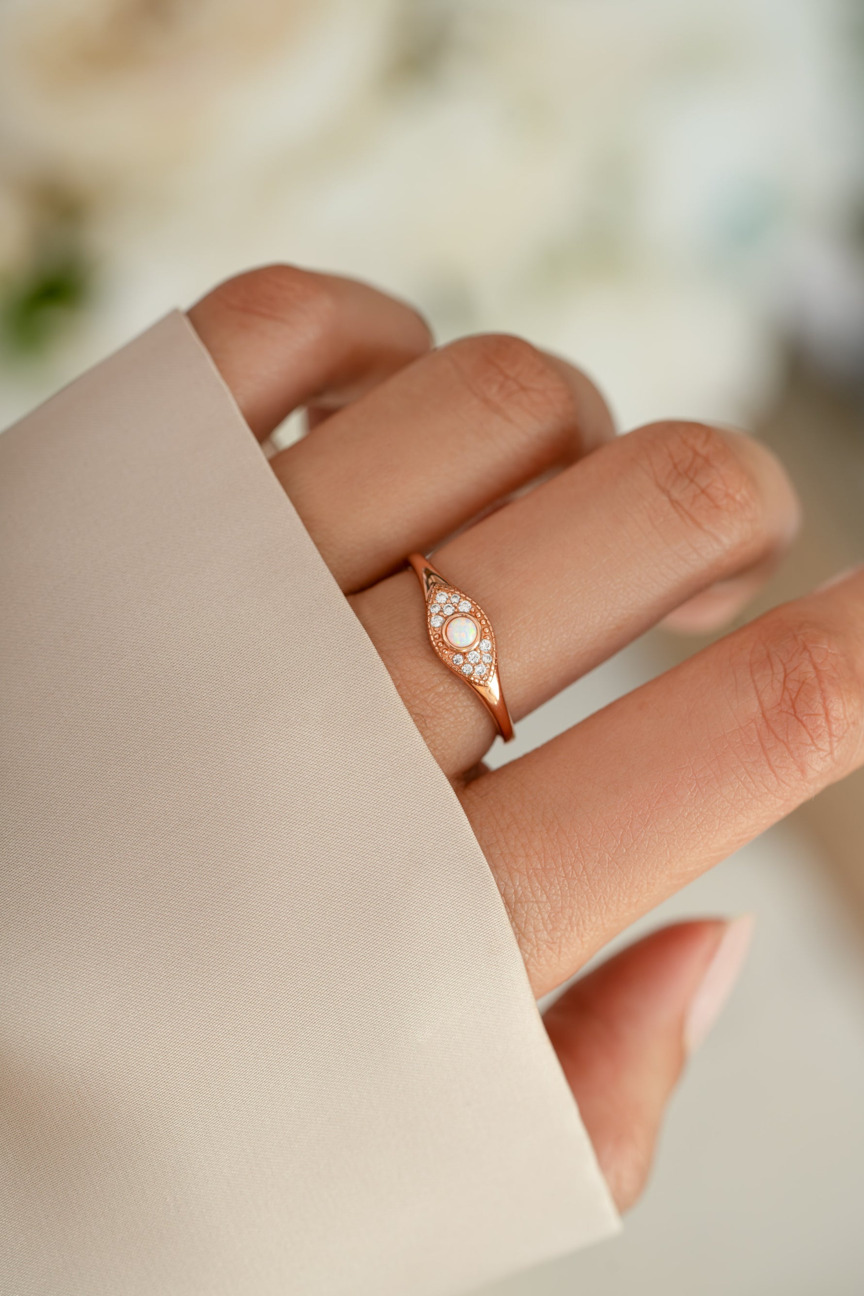 Rose gold Opal Evil Eye ring by Sami Jewels featuring a vibrant opal stone and protective evil eye design.