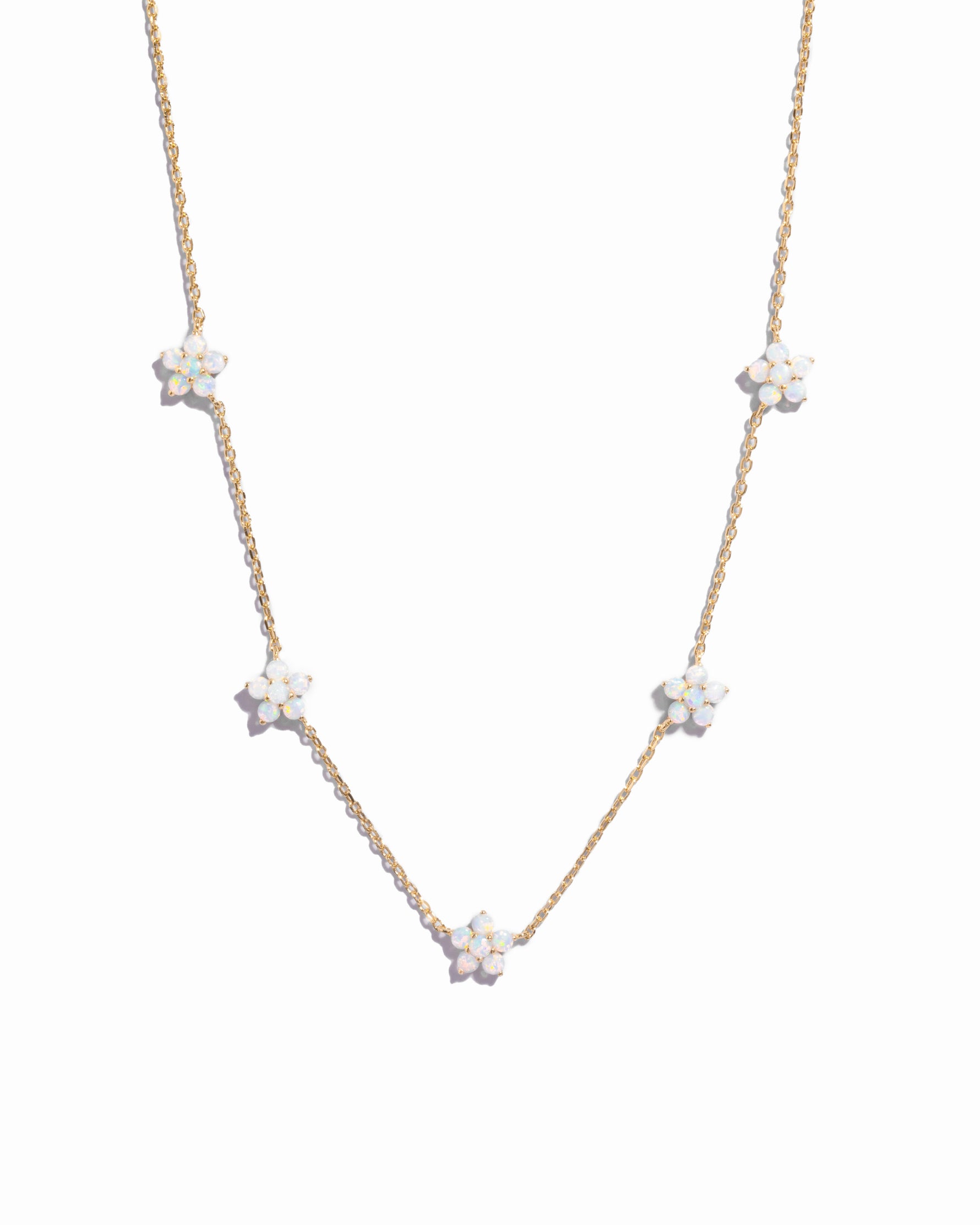 Gold Opal Flower Charm Necklace from Sami Jewels featuring a delicate floral design on a white background.