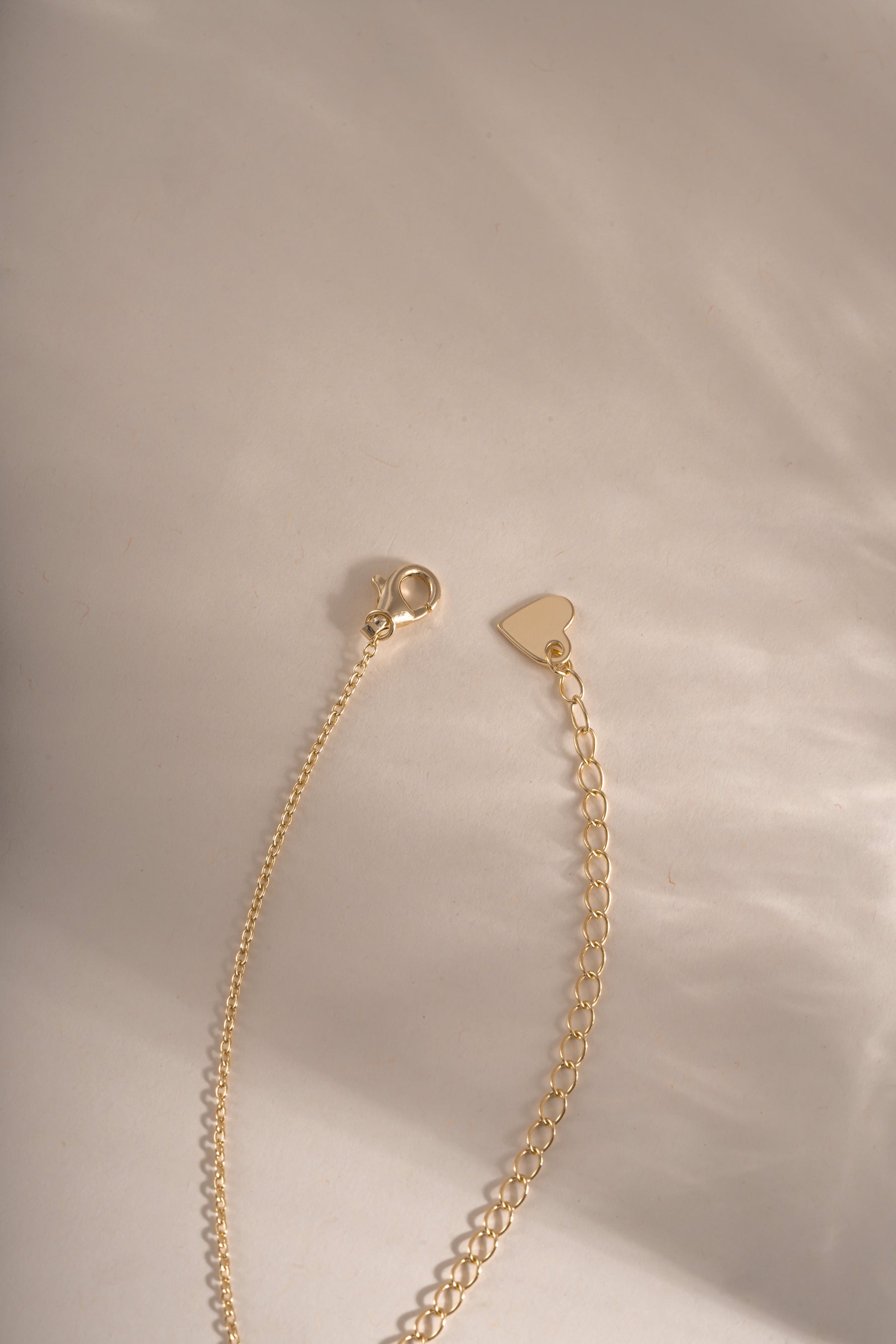 Gold Opal Flower Necklace with lobster clasp closure by Sami Jewels, featuring a delicate floral design and radiant opal centerpiece.