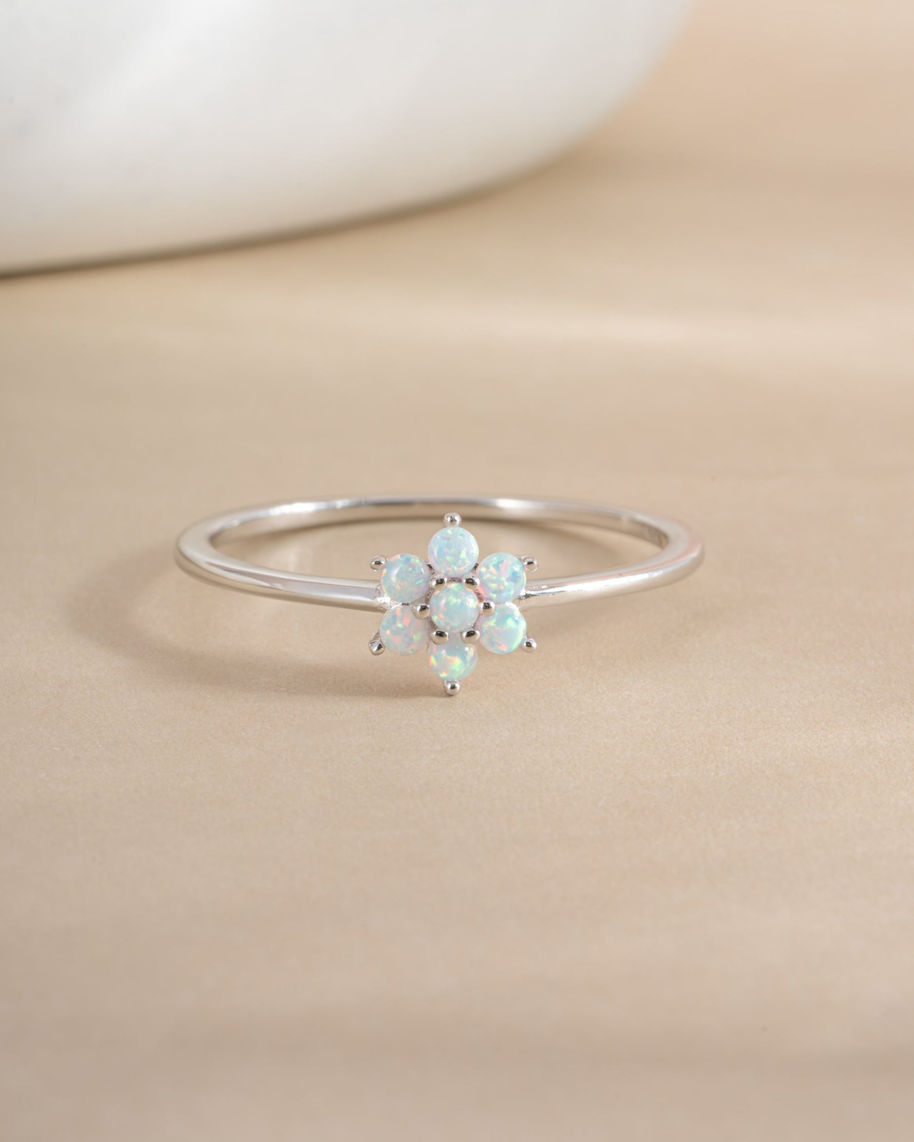 Sterling silver Opal Flower Ring featuring a vibrant opal flower design, showcasing intricate craftsmanship and colorful gemstone details.