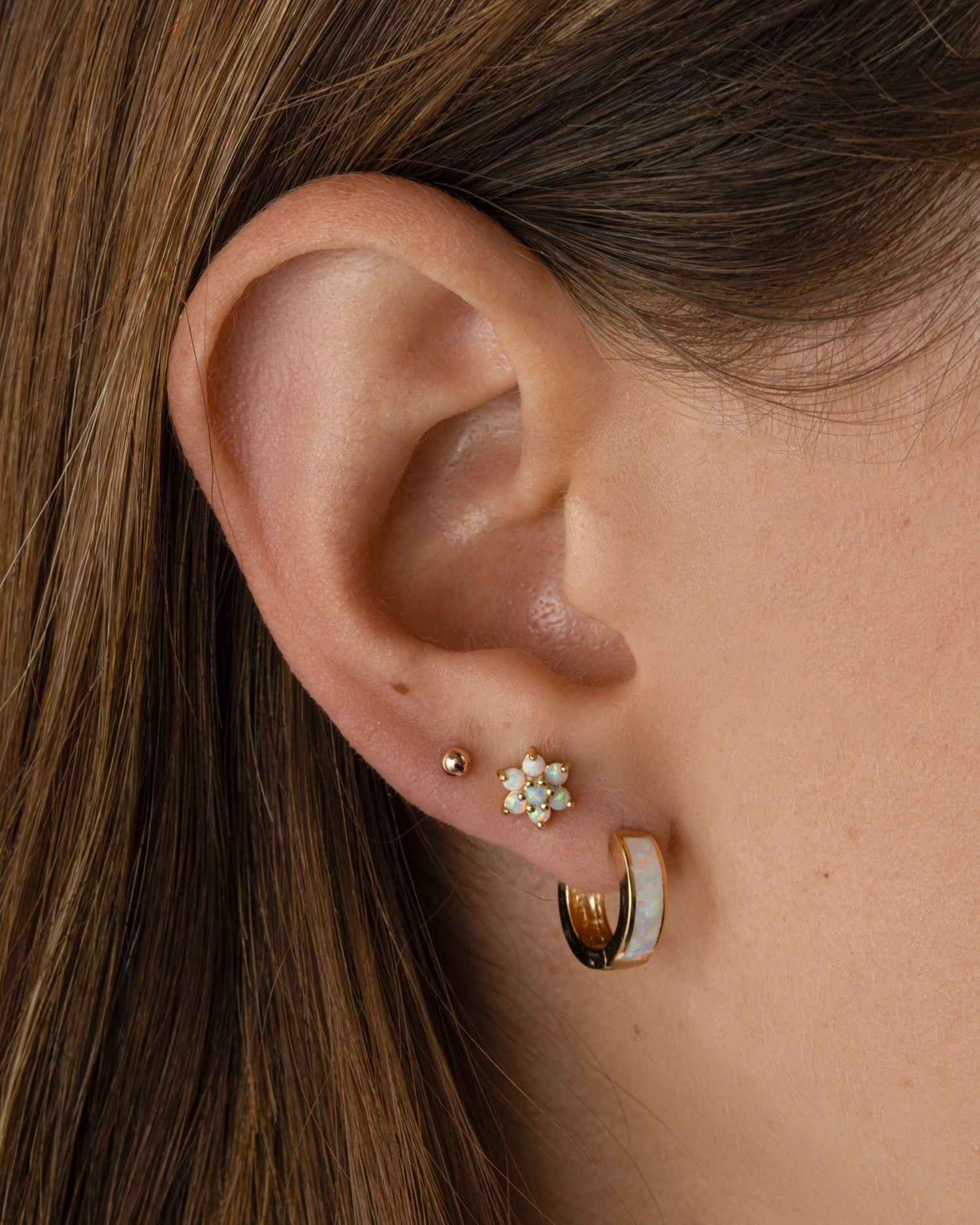 Gold Opal Flower Stud Earrings by Sami Jewels featuring delicate flower-shaped gemstone designs.