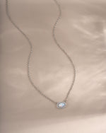 Sterling silver Opal Halo Necklace by Sami Jewels featuring a central opal gemstone surrounded by a halo setting.