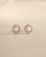Rose gold Opal Halo Stud Earrings by Sami Jewels featuring sparkling opal stones and a delicate halo design.