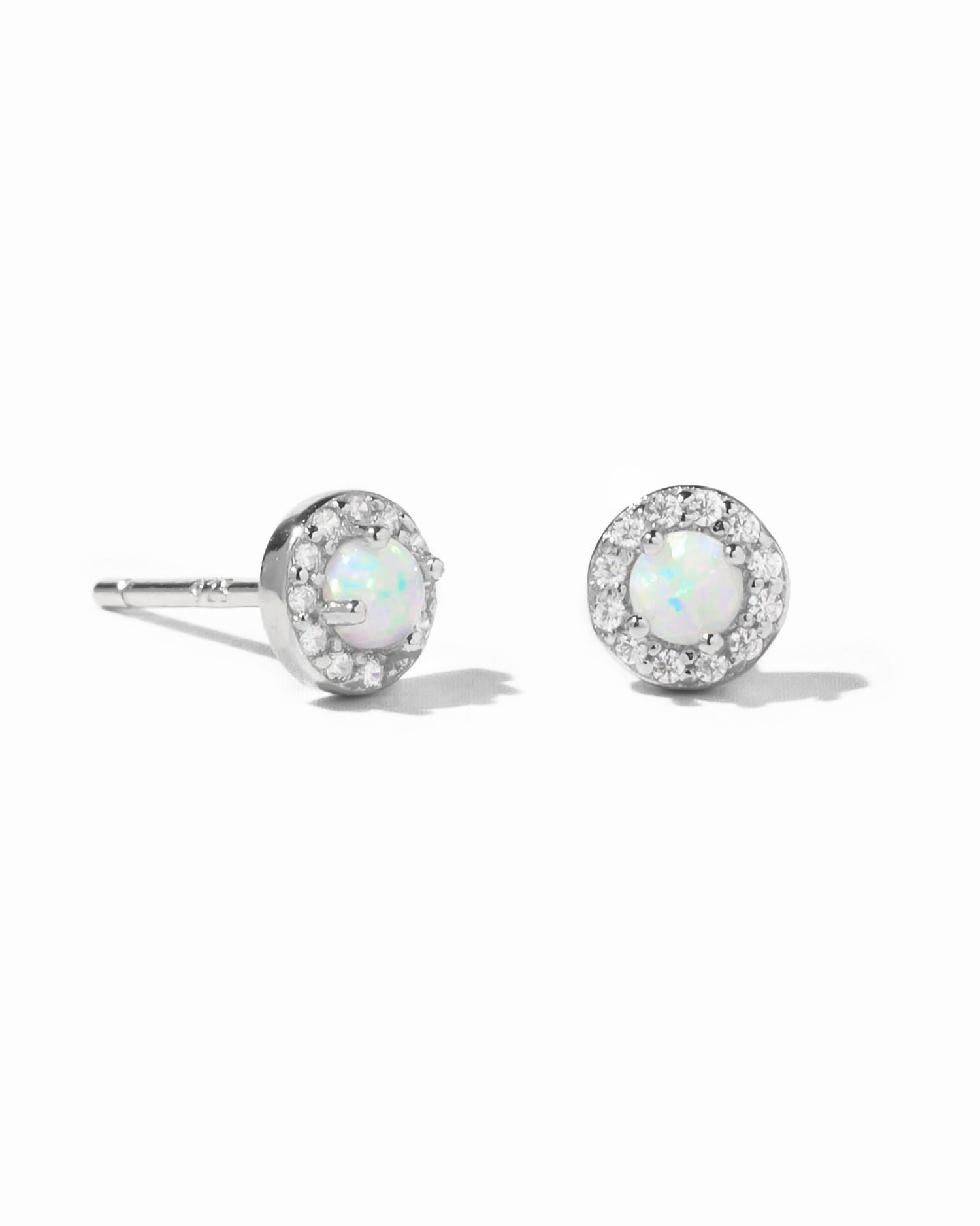Sterling silver opal halo stud earrings by Sami Jewels featuring white opal stones surrounded by a silver halo.