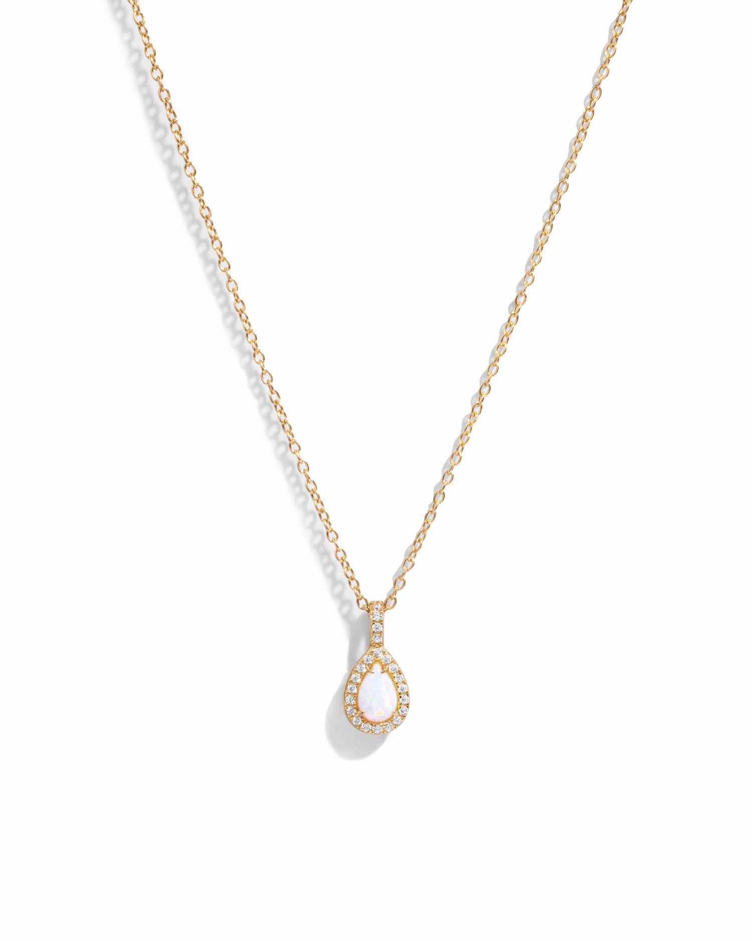 Gold Opal Pear Pendant necklace from Sami Jewels featuring a white opal gemstone on a delicate chain.