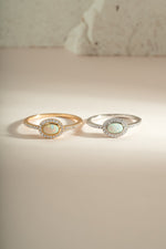 Sami Jewels Opal Halo Ring featuring a vibrant opal gemstone set in gold and sterling silver band.