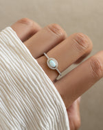 Sterling silver Opal Halo Ring by Sami Jewels featuring a vibrant opal gemstone surrounded by a halo design