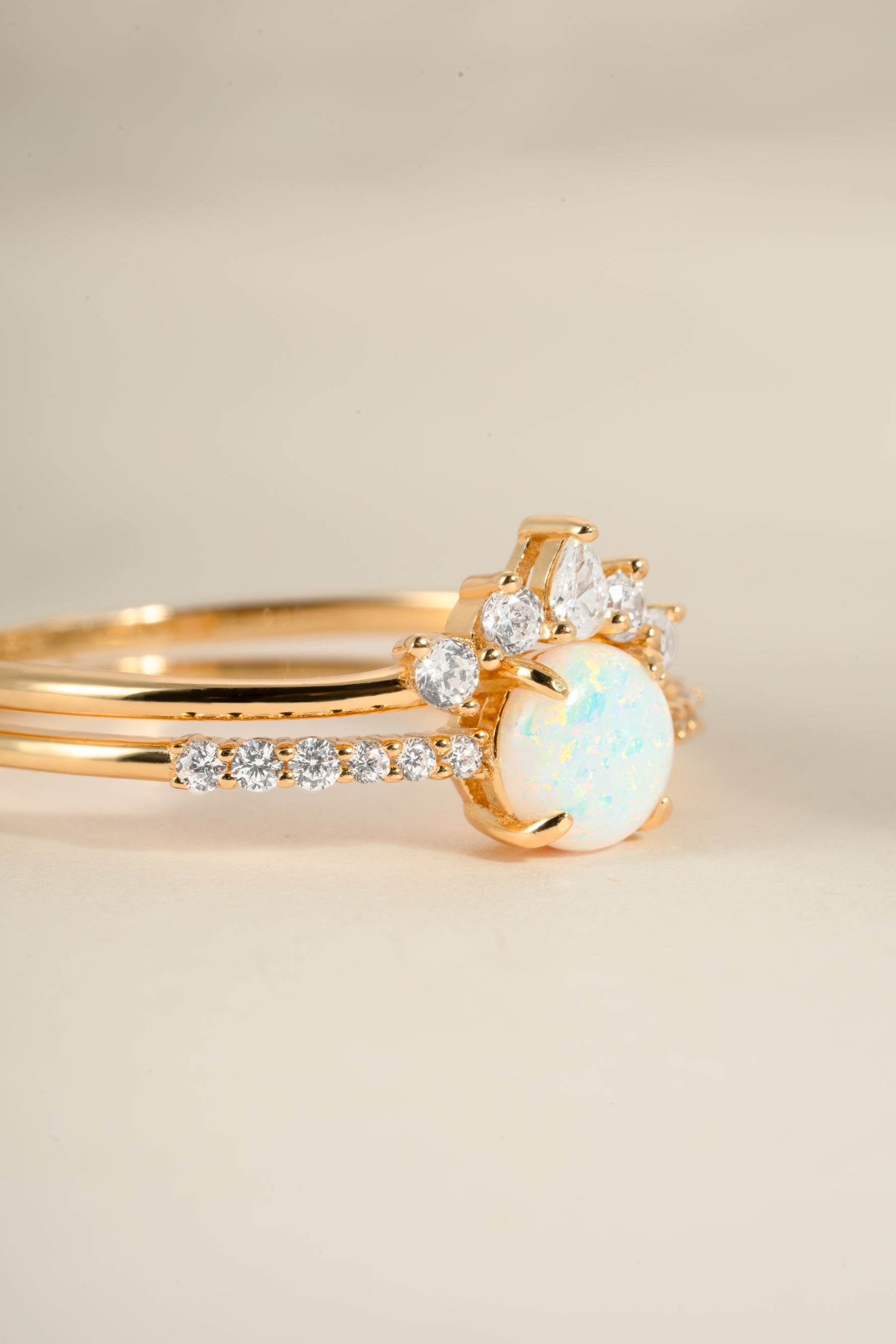 Gold opal ring set with pave accents from Sami Jewels, featuring an elegant angled view of the jewelry.