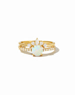 Sami Jewels opal ring set with pave detail, featuring multiple gold rings with vibrant opal stones on a white background.