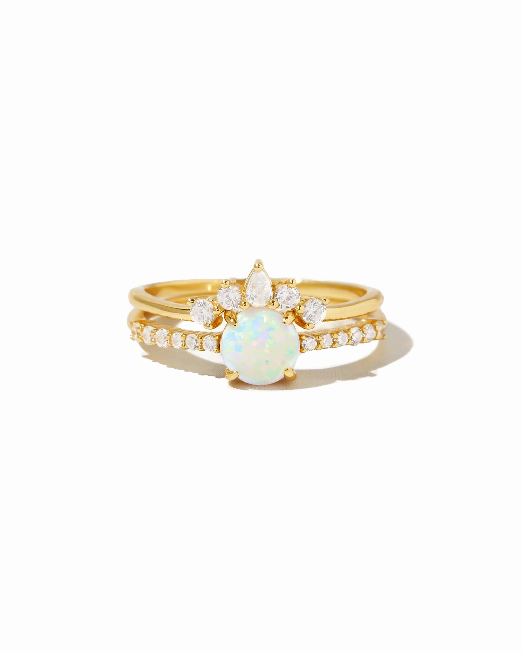 Sami Jewels opal ring set with pave detail, featuring multiple gold rings with vibrant opal stones on a white background.
