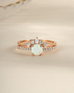 Rose gold opal ring set with pave accents by Sami Jewels, featuring front view of elegant gemstone and intricate band details.