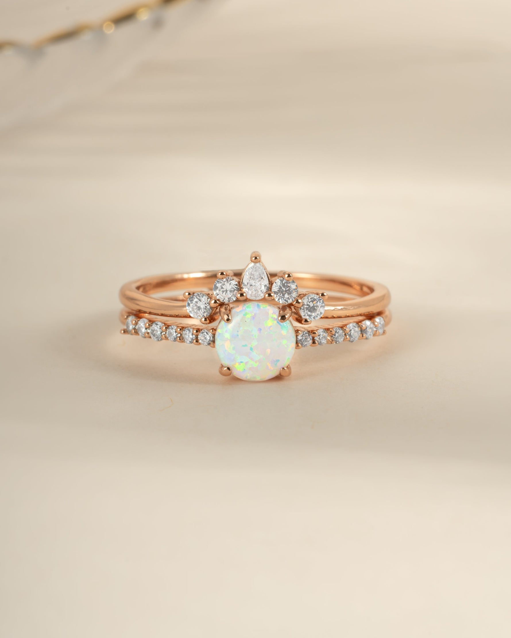 Rose gold opal ring set with pave accents by Sami Jewels, featuring front view of elegant gemstone and intricate band details.