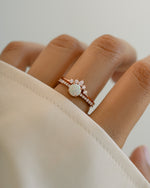 Sami Jewels opal ring set with rose gold pave rings, featuring sparkling gemstone accents and elegant design.