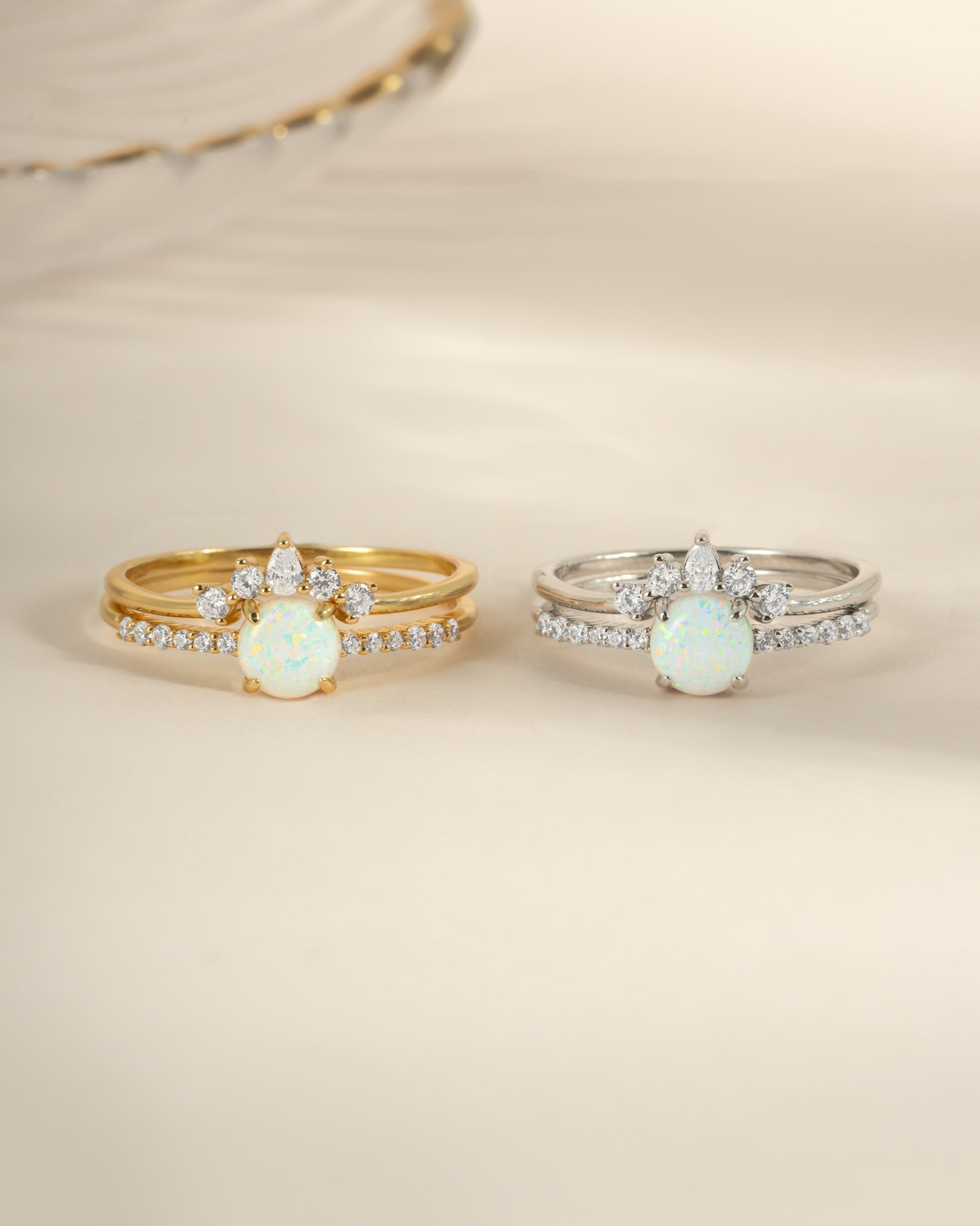 Set of sterling silver and gold opal rings with pave accents from Sami Jewels, featuring vibrant opal gemstones and elegant band designs.