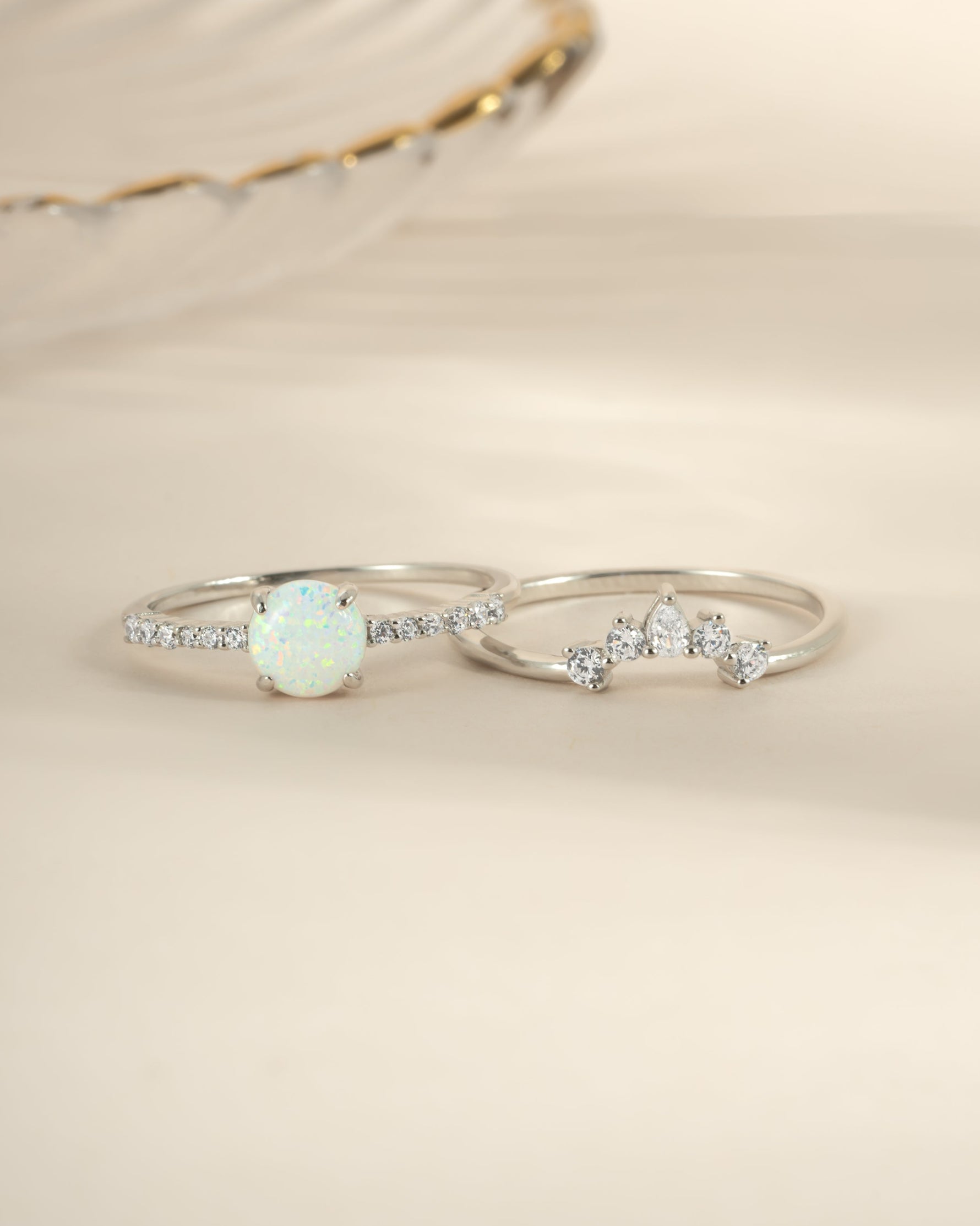 Sterling silver opal ring set with pave detail from Sami Jewels, featuring vibrant opal stones and intricate band designs.